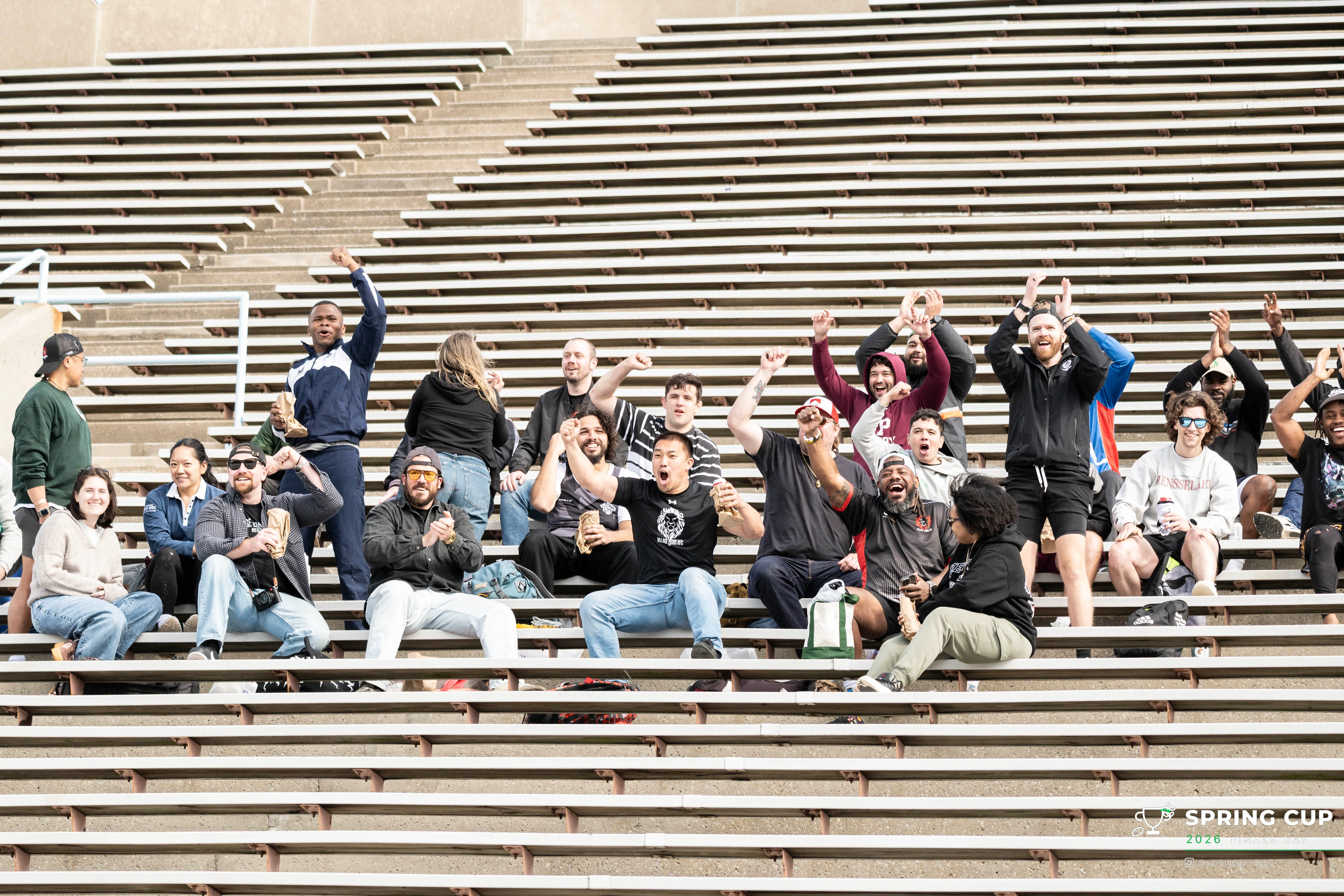 A crowd of supporters celebrates in the Columbia stands