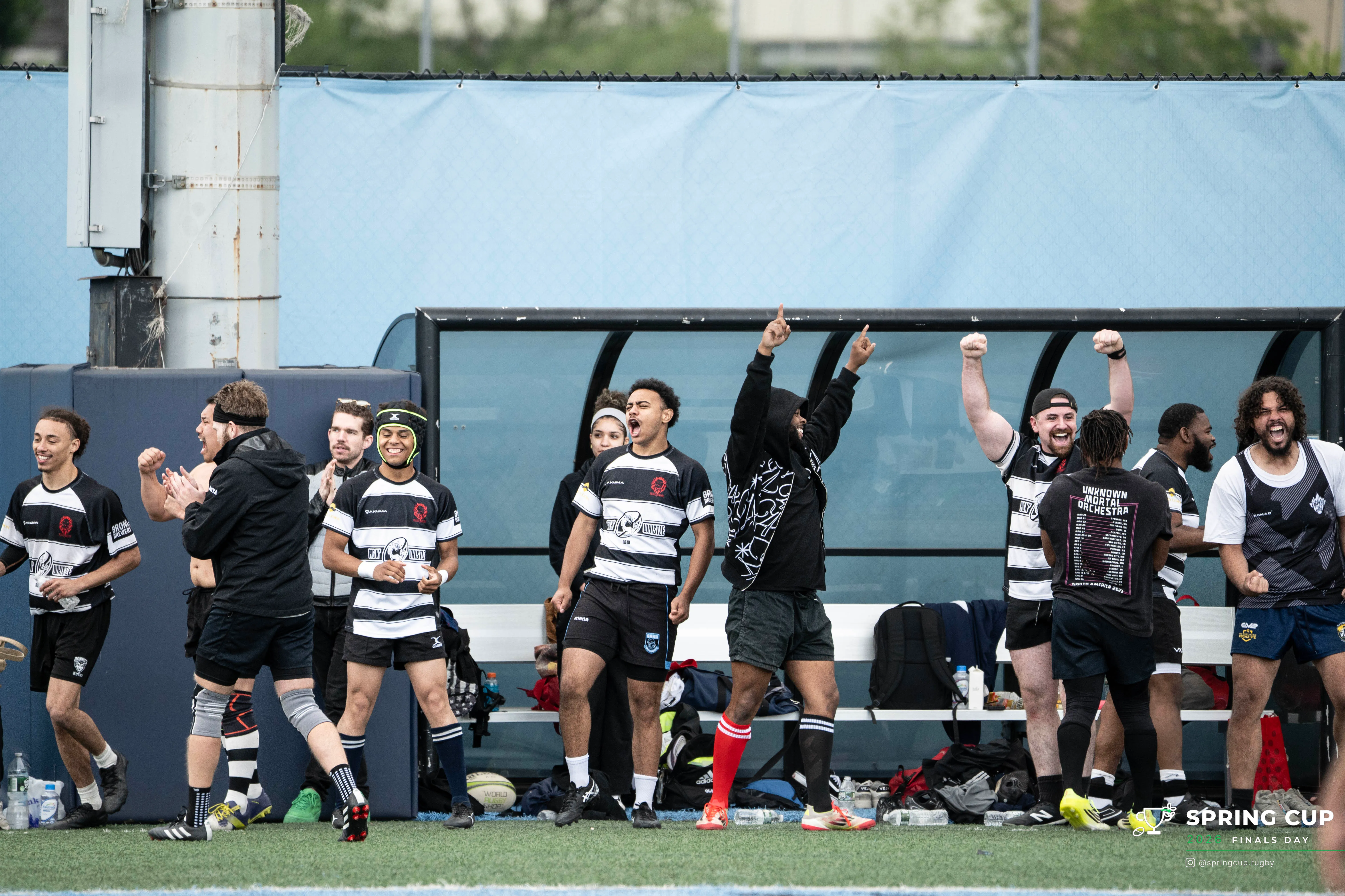 Players celebrate on the sideline as a result goes their way